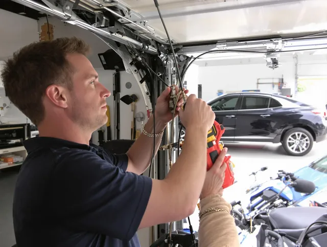 Compton Garage Door Repair safety certified technician performing cable replacement in Compton