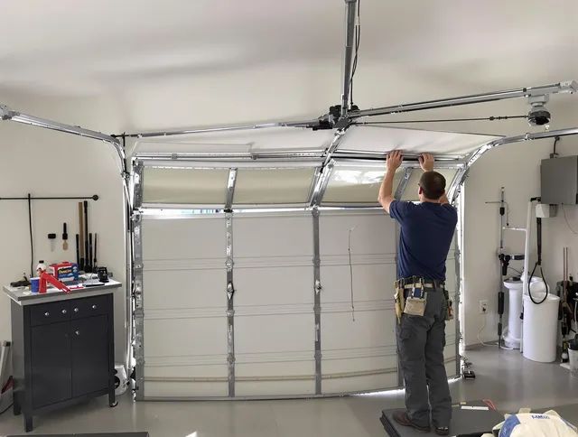 Compton Garage Door Repair specialist performing precise section replacement on Compton garage door